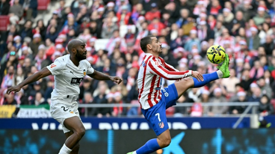  Atletico recover Liga momentum with battling win over Valencia 