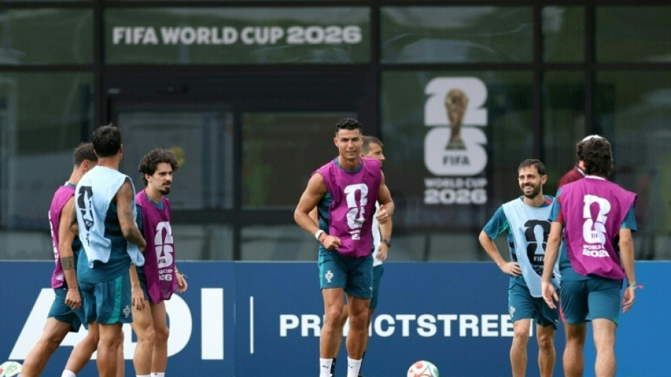 Spain, Portugal eye World Cup last 16  