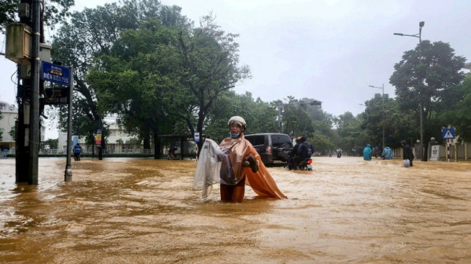 Record Vietnam rains kill seven and flood 100,000 homes
