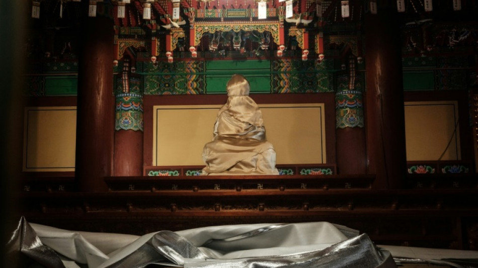 Workers save Buddha as S. Korea's wildfires raze ancient temple