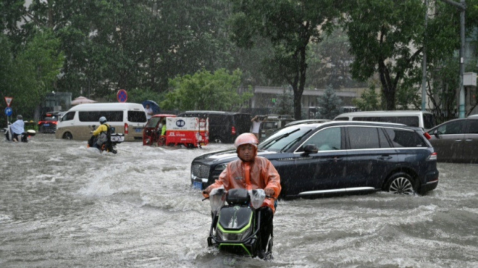  Rescuers search for missing in China storms after 100,000 evacuated 