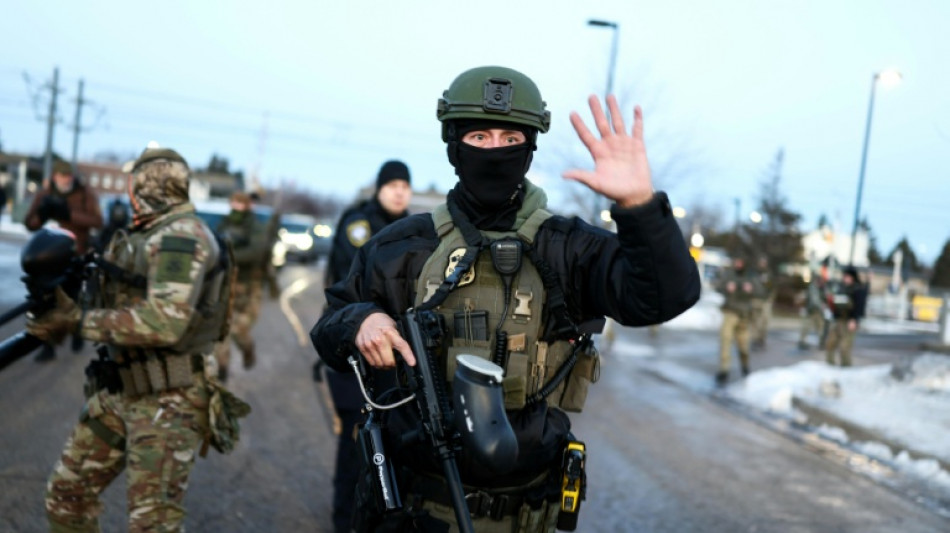 Minneapolis asks to join probe into woman's killing by immigration officer