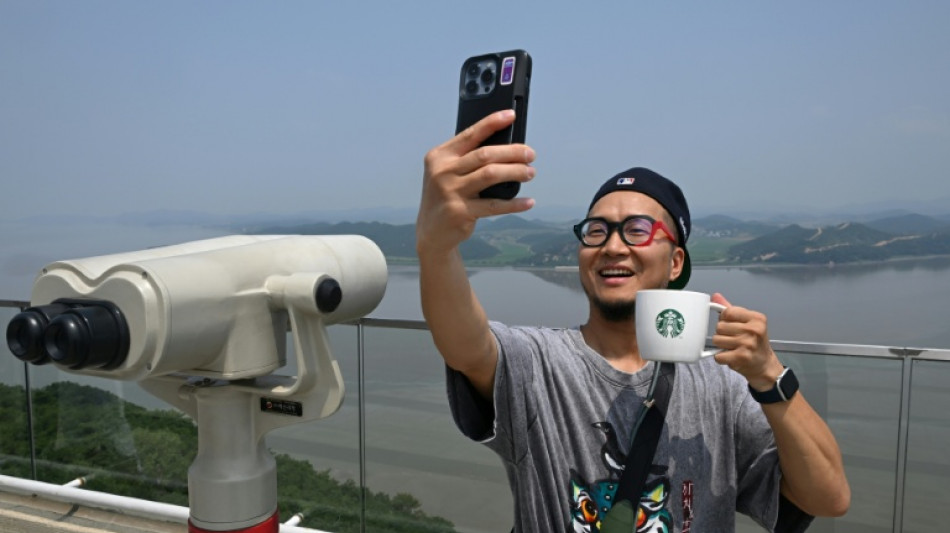  Coffee with a view: tourists flock to Starbucks overlooking North Korea 