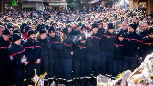 Raw emotion as mourners pay tribute to Swiss fire victims
